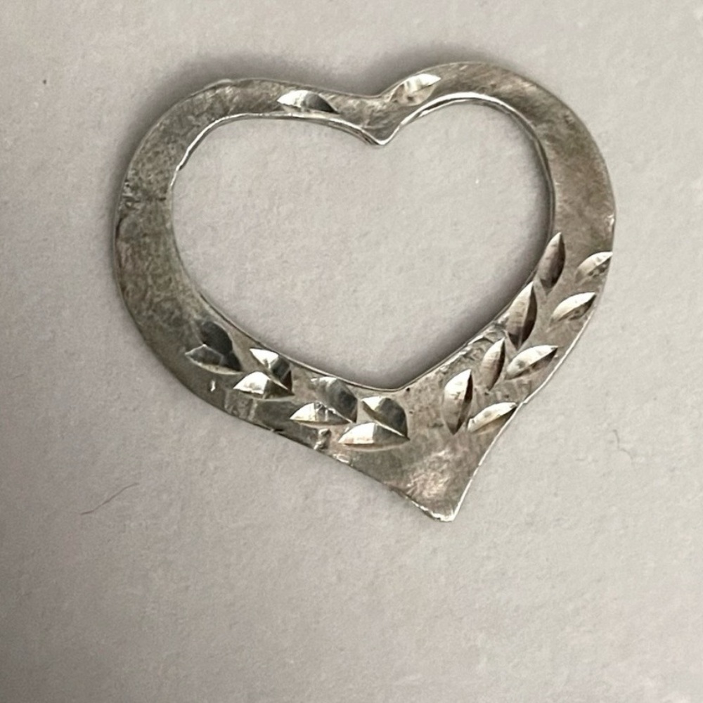 Two vintage sterling silver heart charms 
SEE ALL PICS